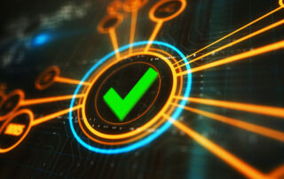 Cyber Assurance concept image: dynamic green tick symbol on a dark computer screen.